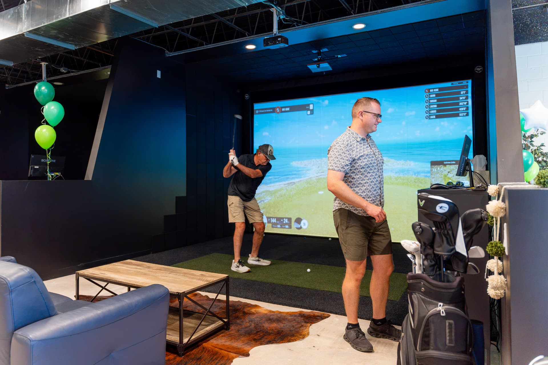 Golfers playing in a bay at The Golf Workshop
